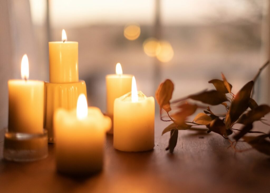 white pillar candles on brown wooden table unlocking inner peace