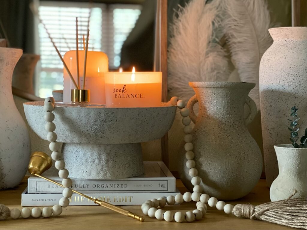 white pillar candles on gray steel candle holder