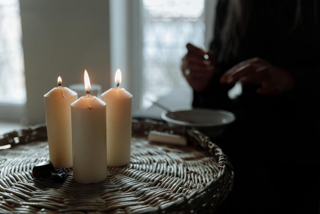 White Pillar Candles on Brown Woven Basket