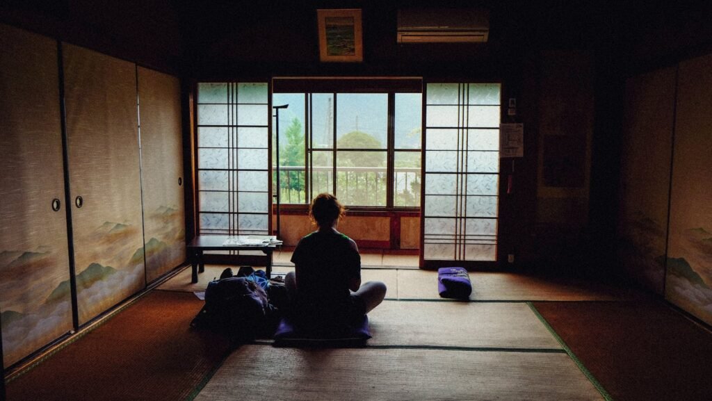 A person practicing focused attention meditation in combination with yoga