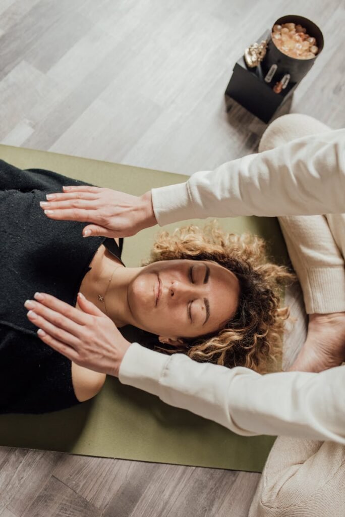 A woman lying on the floor having therapy and guided meditation