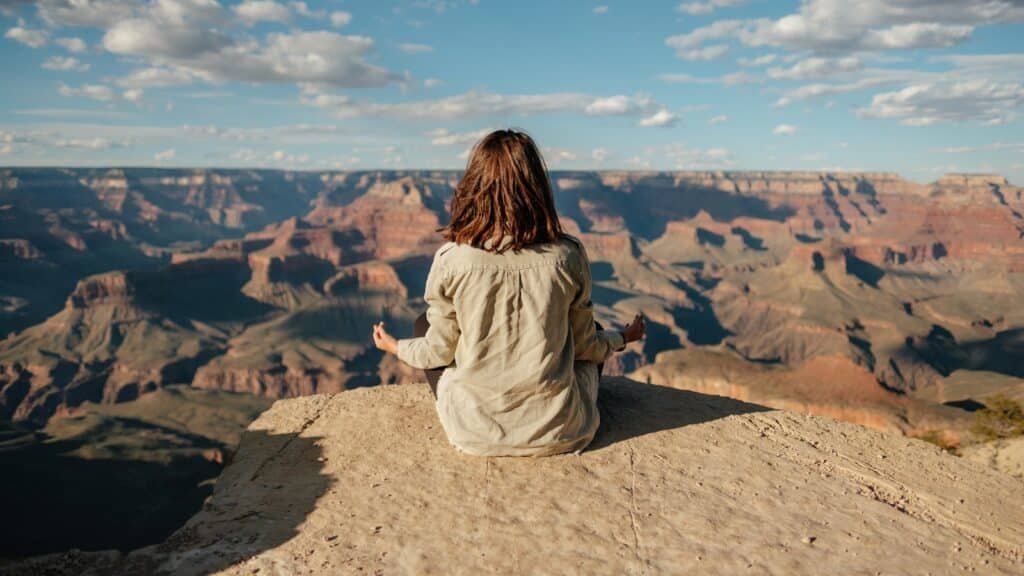 A woman sitting on a hill