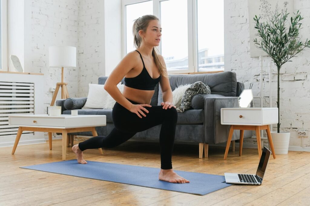 A woman lying on the floor at home in one of many easy yoga poses